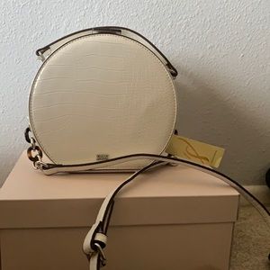 White dome shaped cross body